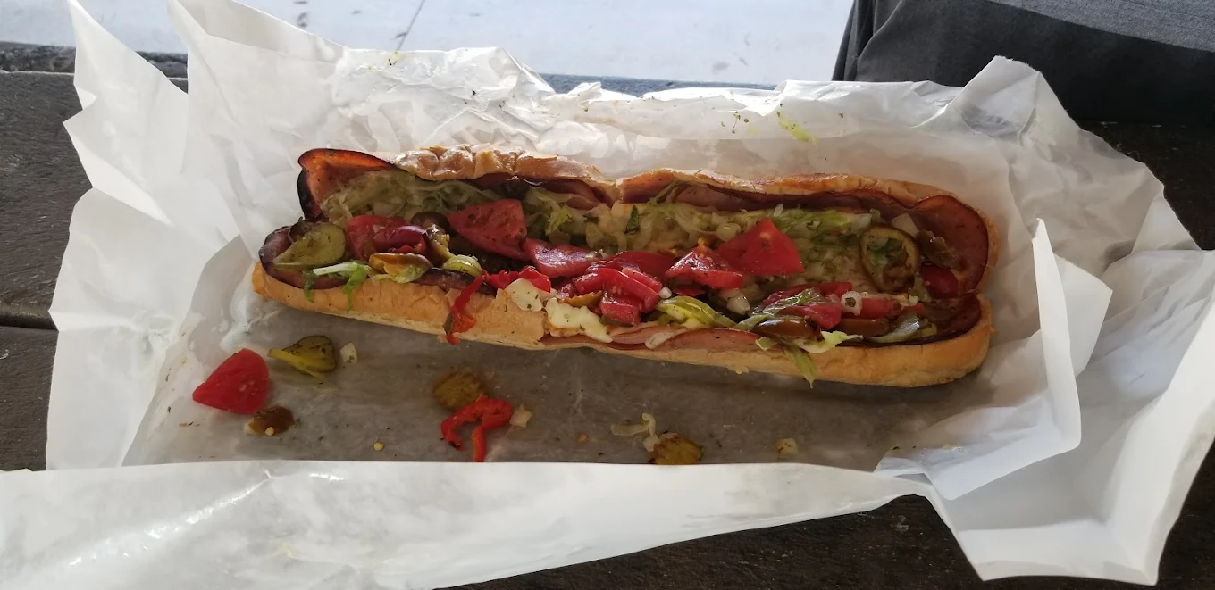 A whole Cooked Hot Italian on its wrapping paper